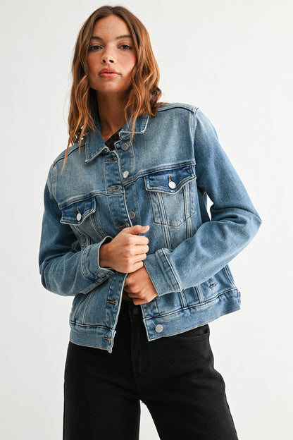 Woman wearing a blue denim jacket on a white background